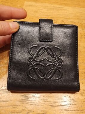 Loewe black leather embossed anagram bifold wallet. 